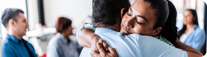 woman hugging a man in support.