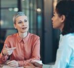 paralegal talking with a client